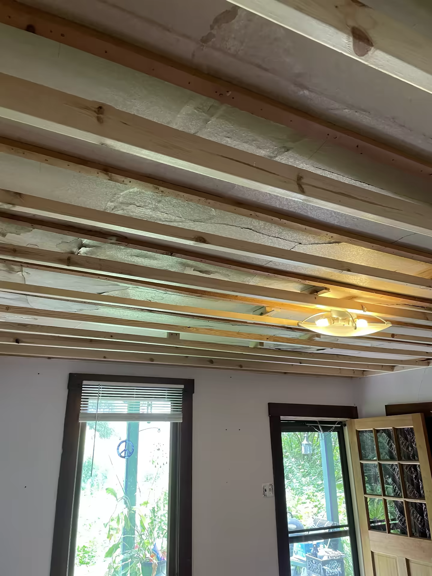Ceiling repair — framing progress with exposed original ceiling