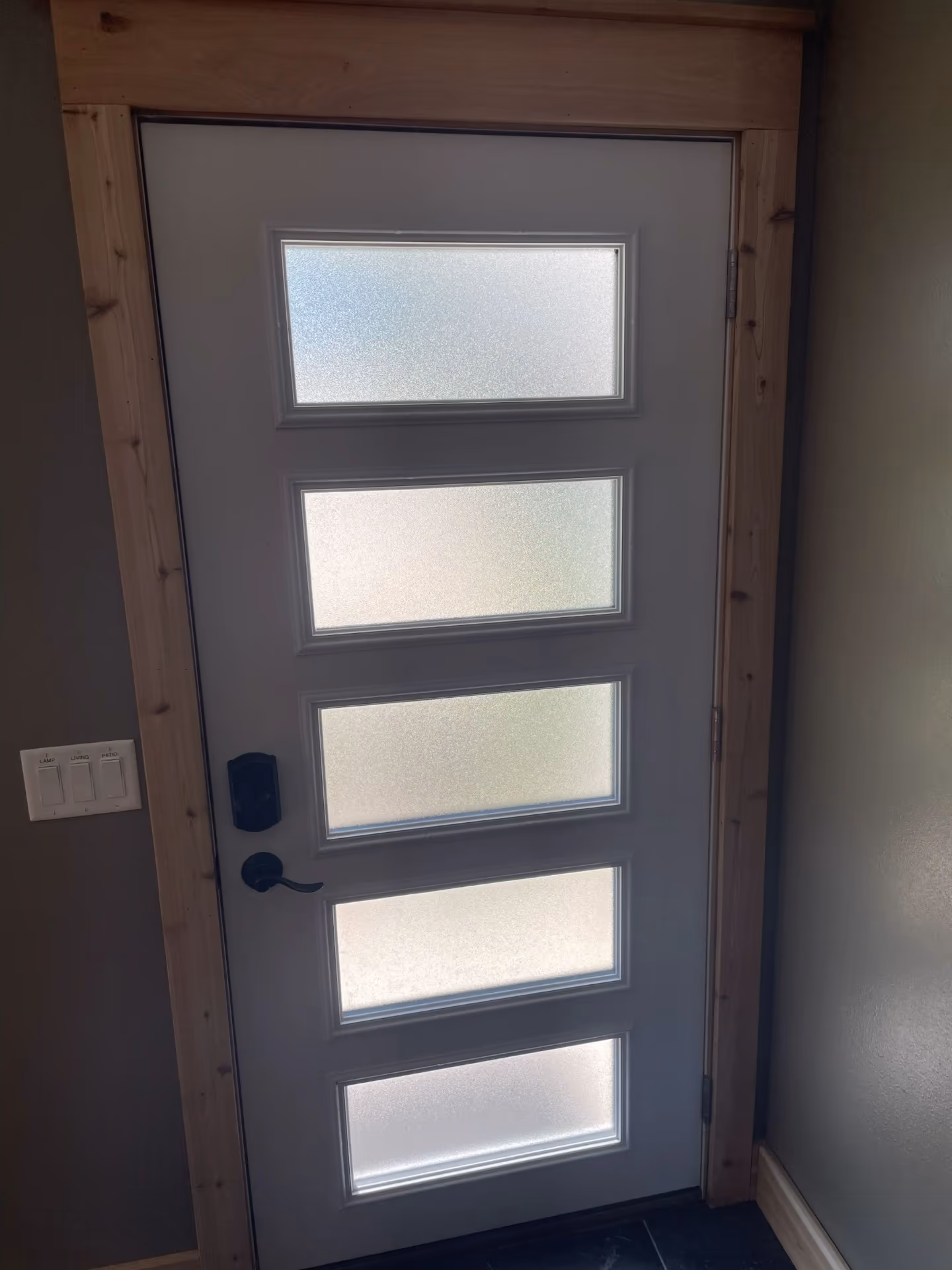 Interior view of new five-lite exterior door with cedar trim