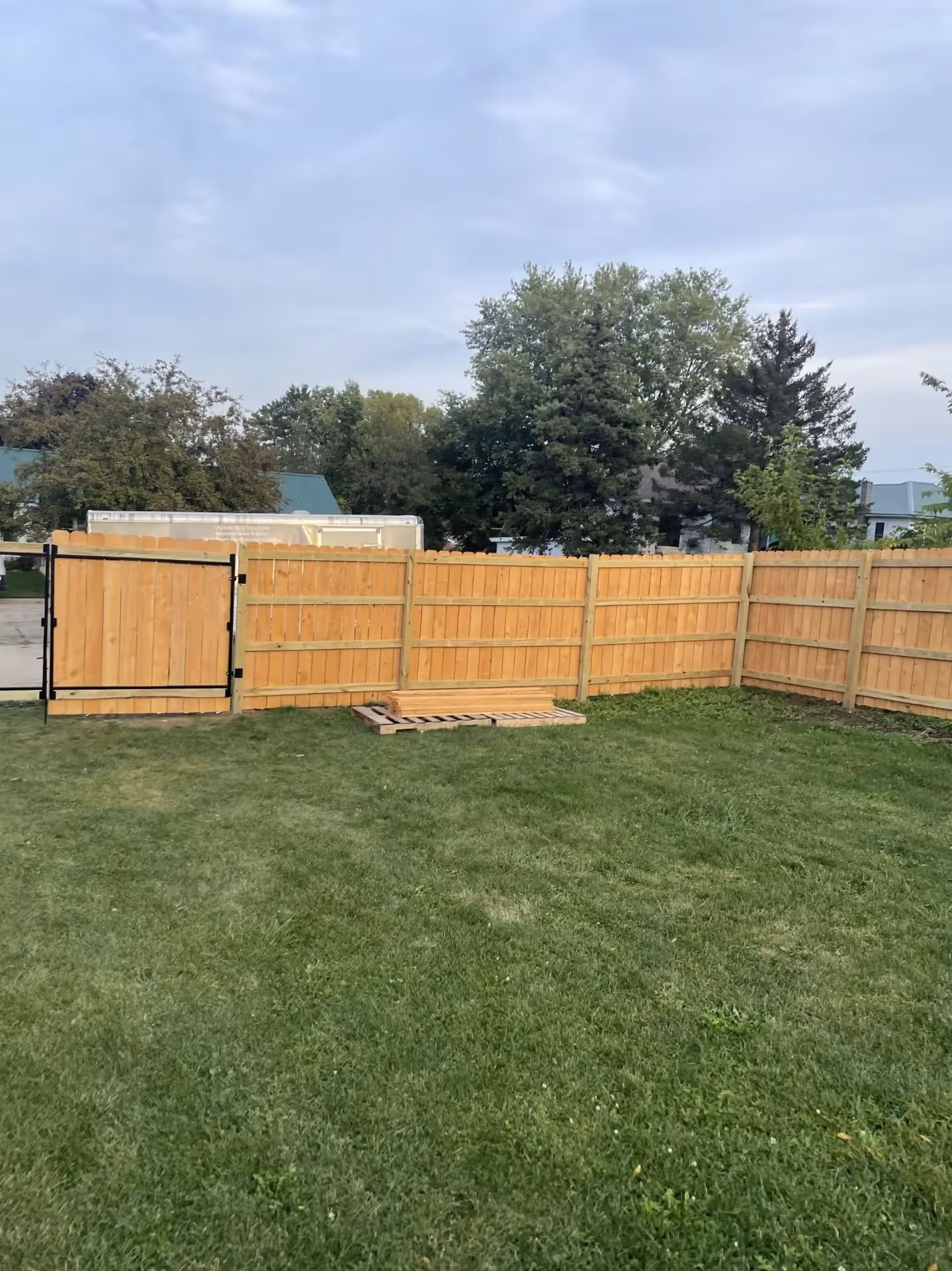 Repaired wood privacy fence in Dodgeville, Wisconsin